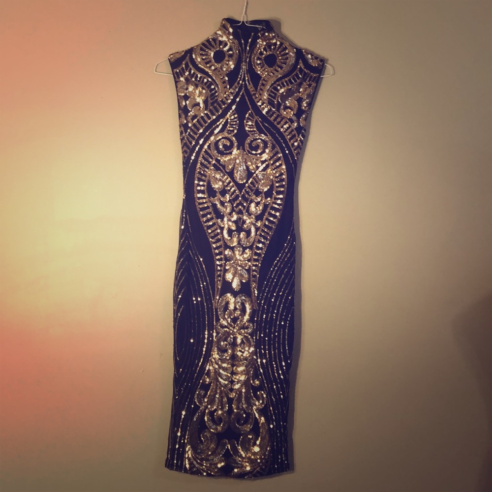 Elegant gold and black sequence cocktail dress.